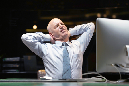 Male-reception suffering from headache migraine pain. Health problem, stress and depression. Male holds head with hand. Hotel manager. Concept of health.の写真素材