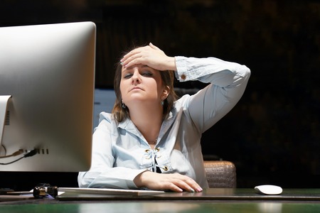 Close-up office worker Woman suffering from headache migraine pain. Health problem, stress and...