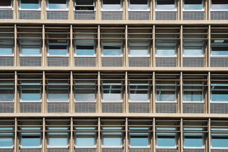 Glass blue square Windows of facade modern city business building skyscraper. Modern apartment...