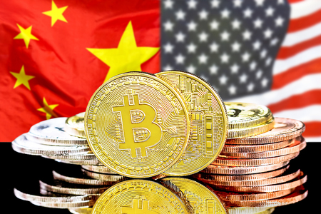 Bitcoins on the background of the flag China and United States of America. Concept for investors in cryptocurrency and Blockchain technology in the China and United States.の写真素材