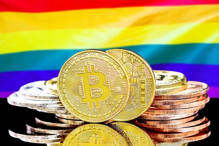 Bitcoins on the background of the flag LGBT gay. Bitcoins on the background of the LGBT gay flag.の写真素材