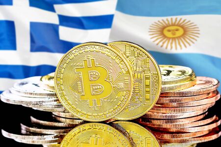 Concept for investors in cryptocurrency and Blockchain technology in the Greece and Argentina. Bitcoins on the background of the flag Greece and Argentina.の写真素材