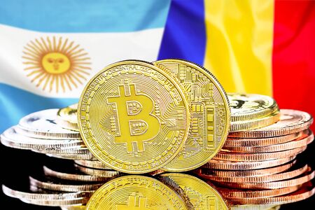Bitcoins on the background of the flag Argentina and Moldova. Concept for investors in cryptocurrency and Blockchain technology in the Argentina and Moldova.の写真素材