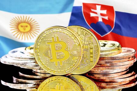Bitcoins on the background of the flag Argentina and Slovakia. Concept for investors in cryptocurrency and Blockchain technology in the Argentina and Slovakia.の写真素材