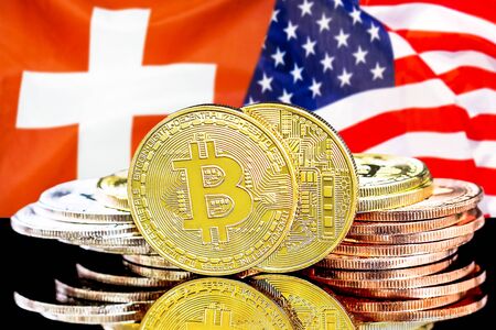 Concept for investors in cryptocurrency and Blockchain technology in the Switzerland and United States of America. Bitcoins on the background of the flag Switzerland and US.の写真素材