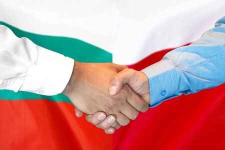 Business handshake on the background of two flags. Men handshake on the background of the Bulgaria and Poland flag. Support conceptの写真素材