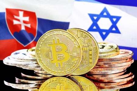 Concept for investors in cryptocurrency and Blockchain technology in the Slovakia and Israel. Bitcoins on the background of the flag Slovakia and Israel.の写真素材
