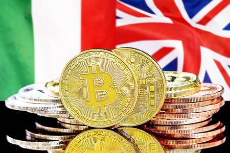 Concept for investors in cryptocurrency and Blockchain technology in the Italy and UK. Bitcoins on the background of the flag Italy and United Kingdom.の写真素材