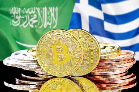 Concept for investors in cryptocurrency and Blockchain technology in the Saudi Arabia and Greece. Bitcoins on the background of the flag Saudi Arabia and Greece.の写真素材