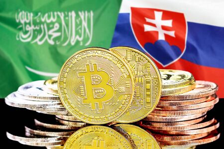 Concept for investors in cryptocurrency and Blockchain technology in the Saudi Arabia and Slovakia. Bitcoins on the background of the flag Saudi Arabia and Slovakia.の写真素材