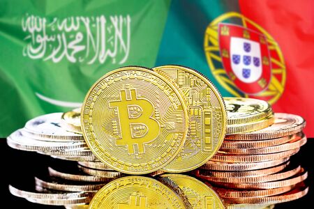 Concept for investors in cryptocurrency and Blockchain technology in the Saudi Arabia and Portugal. Bitcoins on the background of the flag Saudi Arabia and Portugal.の写真素材