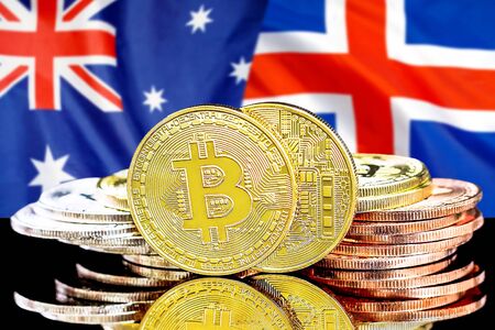 Concept for investors in cryptocurrency and Blockchain technology in the Iceland and Australia. Bitcoins on the background of the flag Iceland and Australia.の写真素材