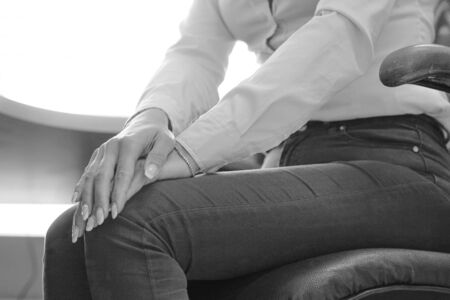 Black and white image of office worker Female Leg With Painful Knees. Woman Feeling Joint Pain,...
