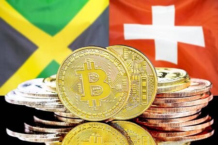 Concept for investors in cryptocurrency and Blockchain technology in the Jamaica and Switzerland. Bitcoins on the background of the flag Jamaica and Switzerland.の写真素材