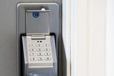Door code in the handle of the entrance door to the apartment close-up. Secure password on keyboard...