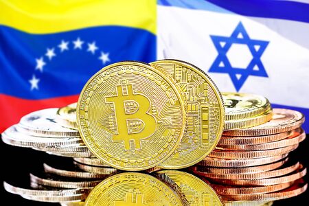 Concept for investors in cryptocurrency and Blockchain technology in the Venezuela and Israel. Bitcoins on the background of the flag Venezuela and Israel.の写真素材