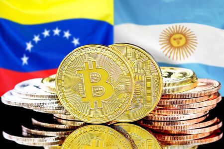 Concept for investors in cryptocurrency and Blockchain technology in the Venezuela and Argentina. Bitcoins on the background of the flag Venezuela and Argentina.の写真素材