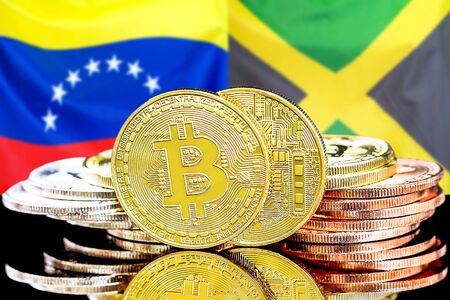 Concept for investors in cryptocurrency and Blockchain technology in the Venezuela and Jamaica. Bitcoins on the background of the flag Venezuela and Jamaica.の写真素材