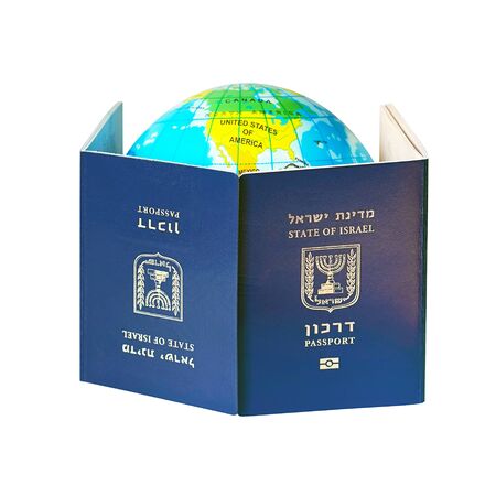 Blue Israeli biometric and non biometric passport isolated on white background. A map or globe of planet earth. International travel identification document. The concept of travel.の写真素材