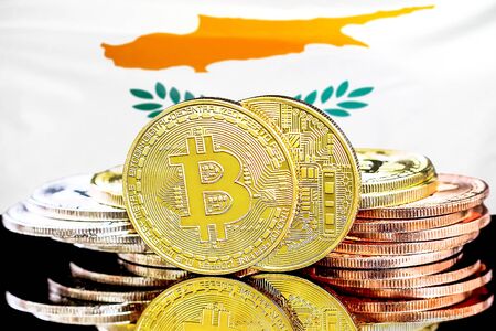 Concept for investors in cryptocurrency and Blockchain technology in the Cyprus. Bitcoins on the background of the flag Cyprus.の写真素材
