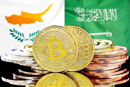 Concept for investors in cryptocurrency and Blockchain technology in the Cyprus and Saudi Arabia. Bitcoins on the background of the flag Cyprus and Saudi Arabia.の写真素材