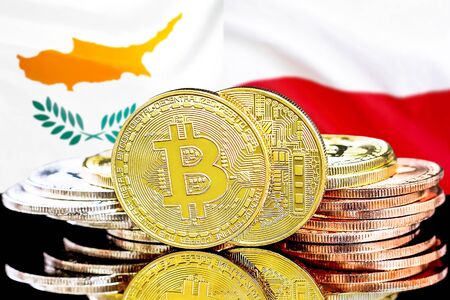 Concept for investors in cryptocurrency and Blockchain technology in the Cyprus and Poland. Bitcoins on the background of the flag Cyprus and Poland.の写真素材