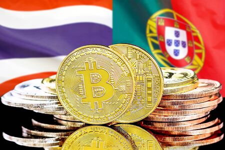 Concept for investors in cryptocurrency and Blockchain technology in the Thailand and Portugal. Bitcoins on the background of the flag Thailand and Portugal.の写真素材