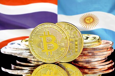 Concept for investors in cryptocurrency and Blockchain technology in the Thailand and Argentina. Bitcoins on the background of the flag Thailand and Argentina.の写真素材