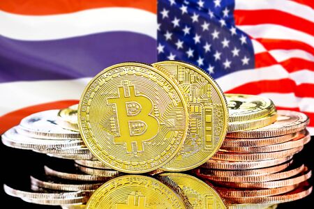 Concept for investors in cryptocurrency and Blockchain technology in the Thailand and United States of America. Bitcoins on the background of the flag Thailand and US.の写真素材