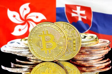Concept for investors in cryptocurrency and Blockchain technology in the Hong Kong and Slovakia. Bitcoins on the background of the flag Hong Kong and Slovakia.の写真素材