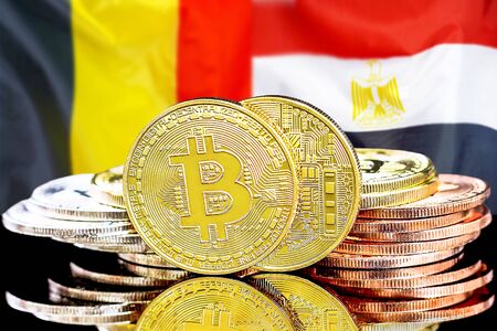 Concept for investors in cryptocurrency and Blockchain technology in the Belgium and Egypt. Bitcoins on the background of the flag Belgium and Egypt.の写真素材