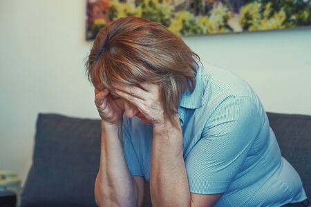 Portrait elderly woman depression or domestic violence. People, grief and domestic violence concept. Close-up of unhappy crying elderly woman.の写真素材