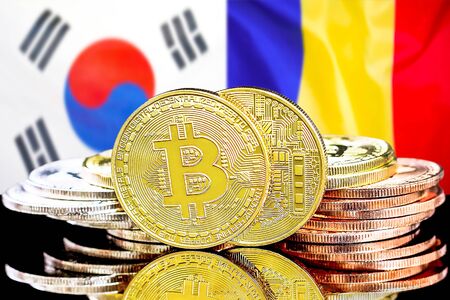 Concept for investors in cryptocurrency and Blockchain technology in the South Korea and Moldova. Bitcoins on the background of the flag South Korea and Moldova.の写真素材
