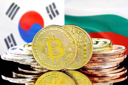 Concept for investors in cryptocurrency and Blockchain technology in the South Korea and Bulgaria. Bitcoins on the background of the flag South Korea and Bulgaria.の写真素材