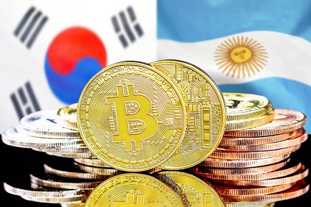 Concept for investors in cryptocurrency and Blockchain technology in the South Korea and Argentina. Bitcoins on the background of the flag South Korea and Argentina.の写真素材