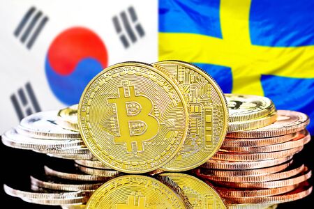 Concept for investors in cryptocurrency and Blockchain technology in the South Korea and Sweden. Bitcoins on the background of the flag South Korea and Sweden.の写真素材