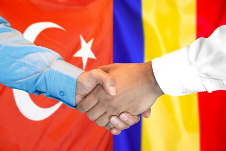 Business handshake on the background of two flags. Men handshake on the background of the Turkey and Moldova flag. Support conceptの写真素材