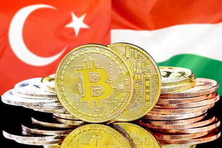 Concept for investors in cryptocurrency and Blockchain technology in the Turkey and Hungary. Bitcoins on the background of the flag Turkey and Hungary.の写真素材