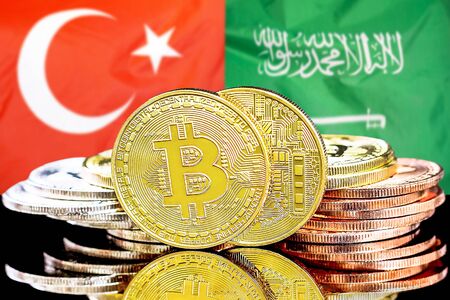Concept for investors in cryptocurrency and Blockchain technology in the Turkey and Saudi Arabia . Bitcoins on the background of the flag Turkey and Saudi Arabia.の写真素材