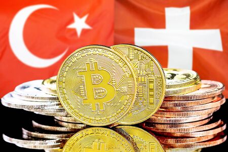 Concept for investors in cryptocurrency and Blockchain technology in the Turkey and Switzerland. Bitcoins on the background of the flag Turkey and Switzerland.の写真素材