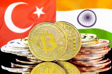 Concept for investors in cryptocurrency and Blockchain technology in the Turkey and India. Bitcoins on the background of the flag Turkey and India.の写真素材