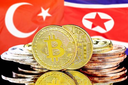 Concept for investors in cryptocurrency and Blockchain technology in the Turkey and North Korea. Bitcoins on the background of the flag Turkey and North Korea.の写真素材