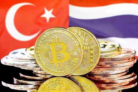 Concept for investors in cryptocurrency and Blockchain technology in the Turkey and Thailand. Bitcoins on the background of the flag Turkey and Thailand.の写真素材