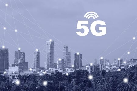 Modern city with wireless network connection concept. Communication network concept 5G smart city on blue background. Blue tone city scape and network connection concept.の写真素材