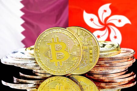 Concept for investors in cryptocurrency and Blockchain technology in the Qatar and Hong Kong. Bitcoins on the background of the flag Qatar and Hong Kong.の写真素材