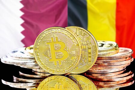 Concept for investors in cryptocurrency and Blockchain technology in the Qatar and Belgium. Bitcoins on the background of the flag Qatar and Belgium.の写真素材