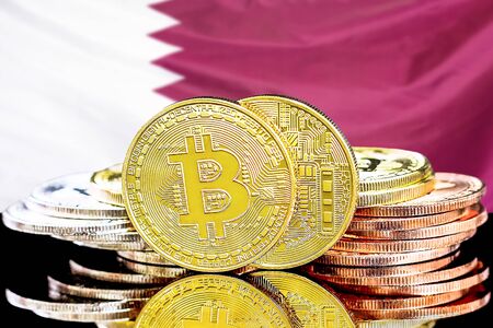 Concept for investors in cryptocurrency and Blockchain technology in the Qatar. Bitcoins on the background of the flag Qatar.の写真素材
