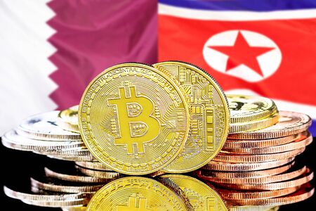 Concept for investors in cryptocurrency and Blockchain technology in the Qatar and North Korea. Bitcoins on the background of the flag Qatar and North Korea.の写真素材