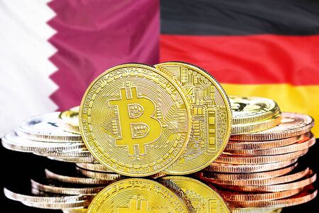 Concept for investors in cryptocurrency and Blockchain technology in the Qatar and Germany. Bitcoins on the background of the flag Qatar and Germany.の写真素材