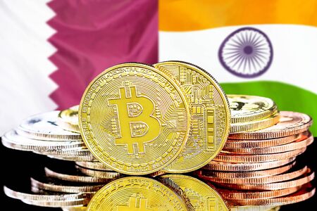 Concept for investors in cryptocurrency and Blockchain technology in the Qatar and India. Bitcoins on the background of the flag Qatar and India.の写真素材